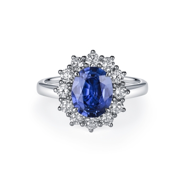 Oval Cut Sapphire Ring with Diamond Cluster in 18ct White Gold