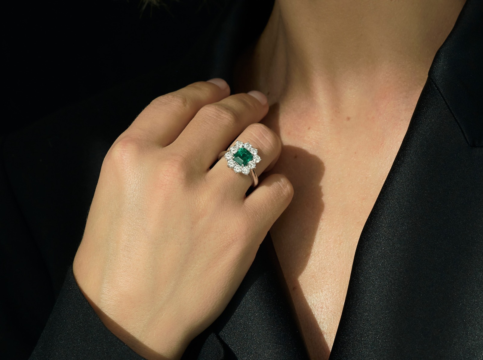 Two Emerald rings worn on a hand